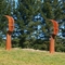 Linha fita de Heek das caras da escultura dois do aço de Corten imaginária